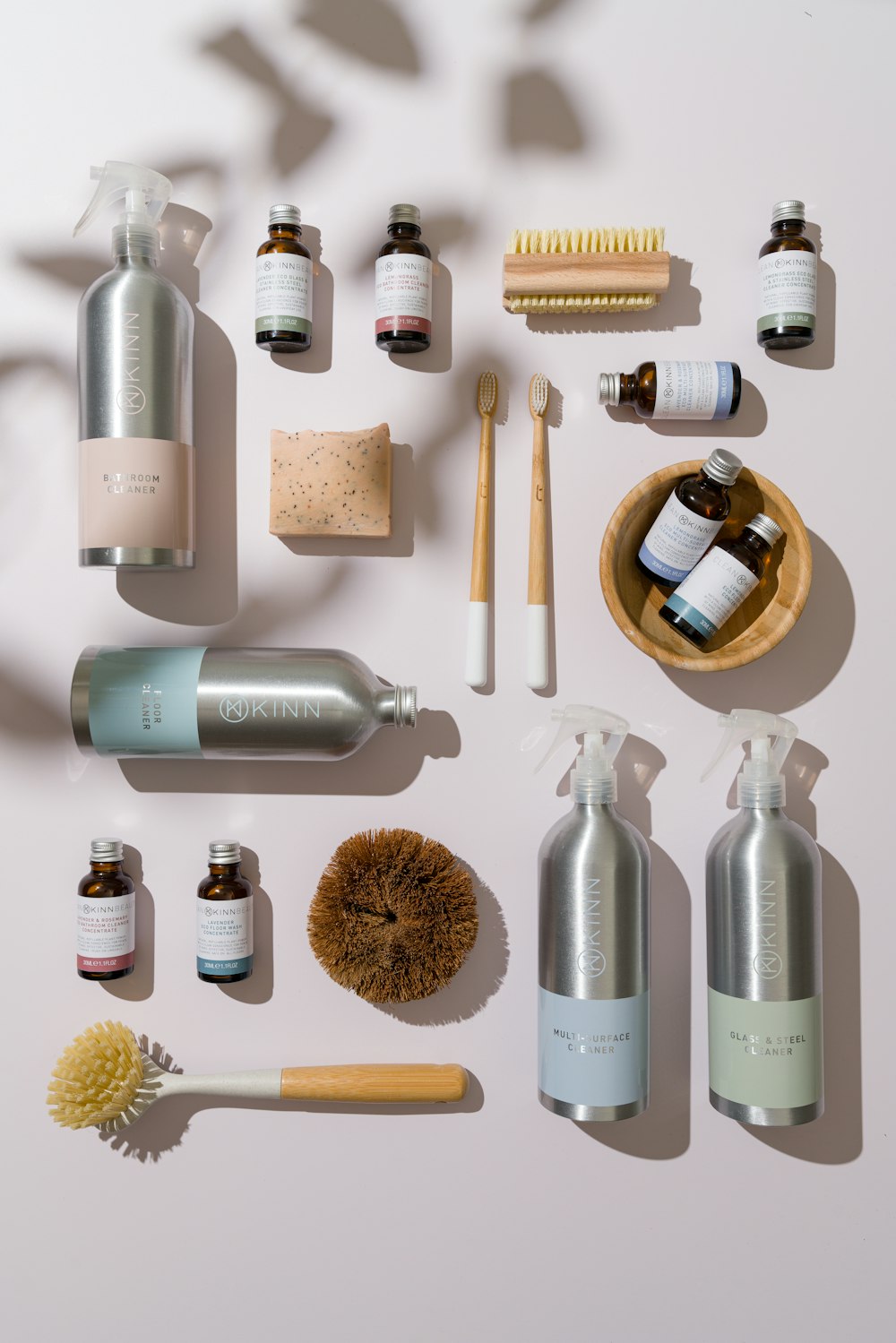 a collection of personal care products arranged on a white surface
