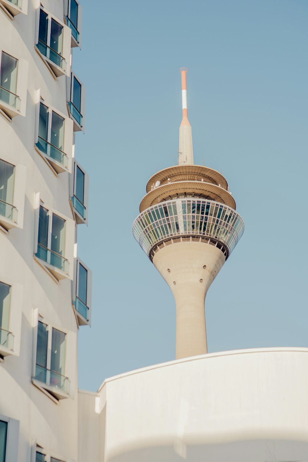 a very tall building with a very tall tower in the background