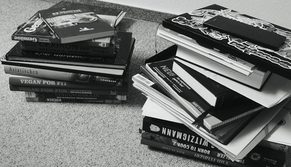 a pile of books sitting on top of a floor