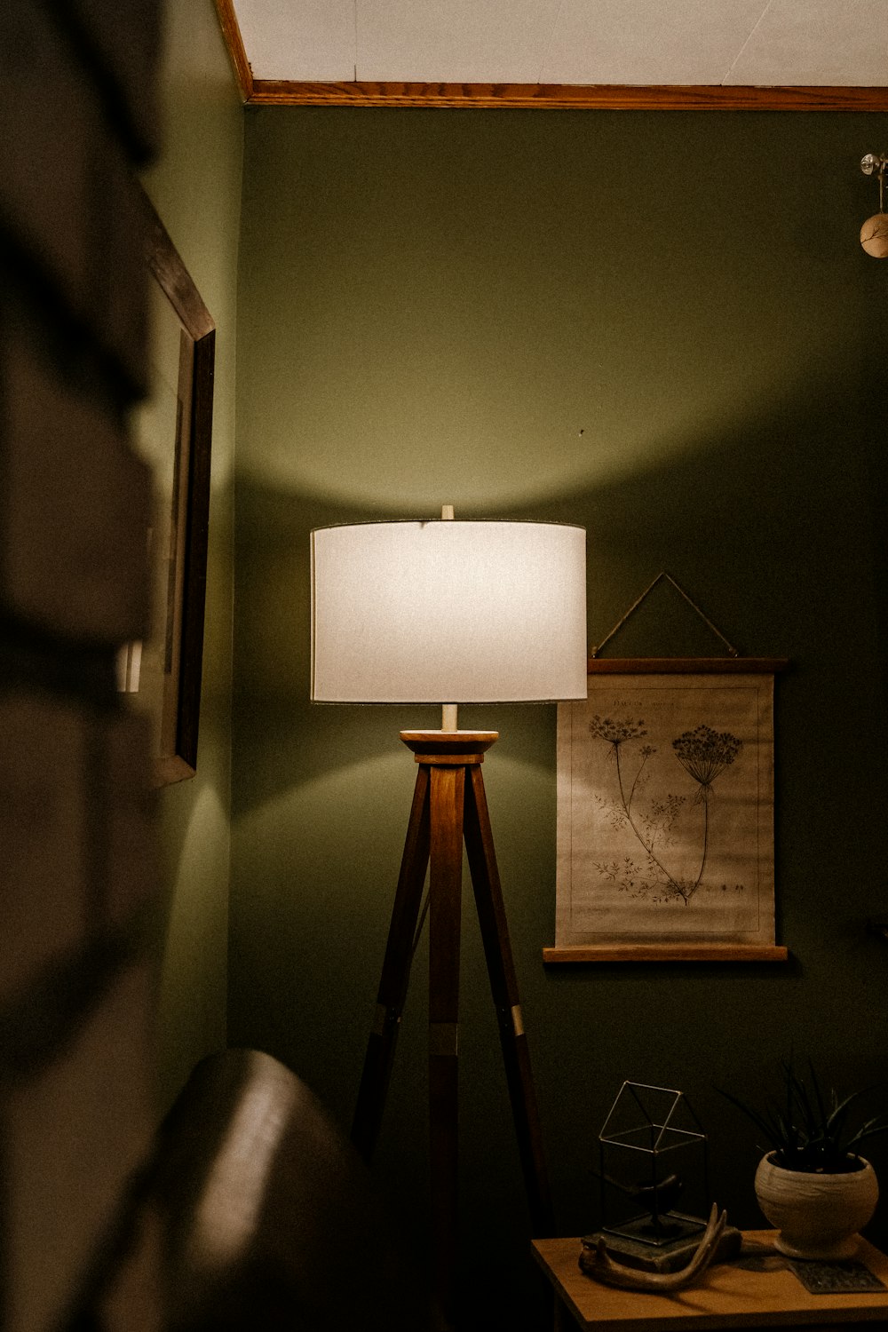 a lamp sitting on top of a wooden table