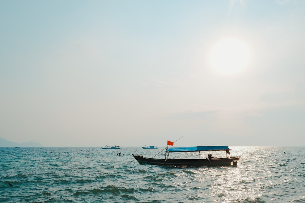 a boat floating on top of a large body of water