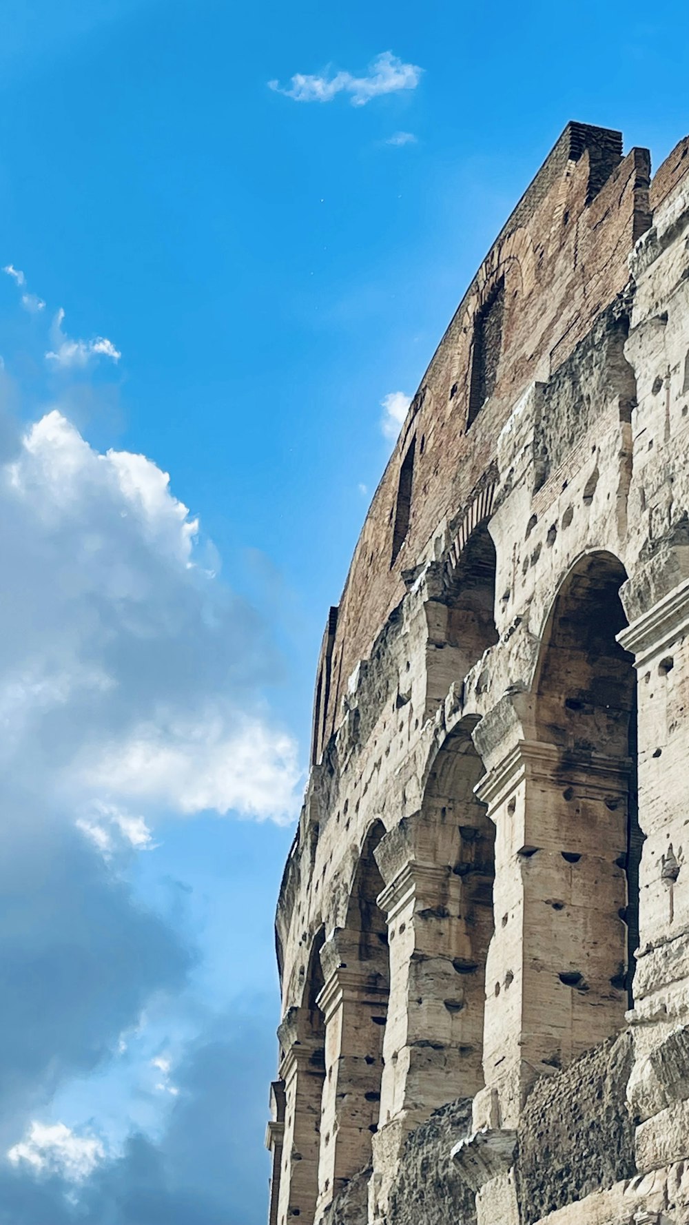 a close up of the side of an ancient building