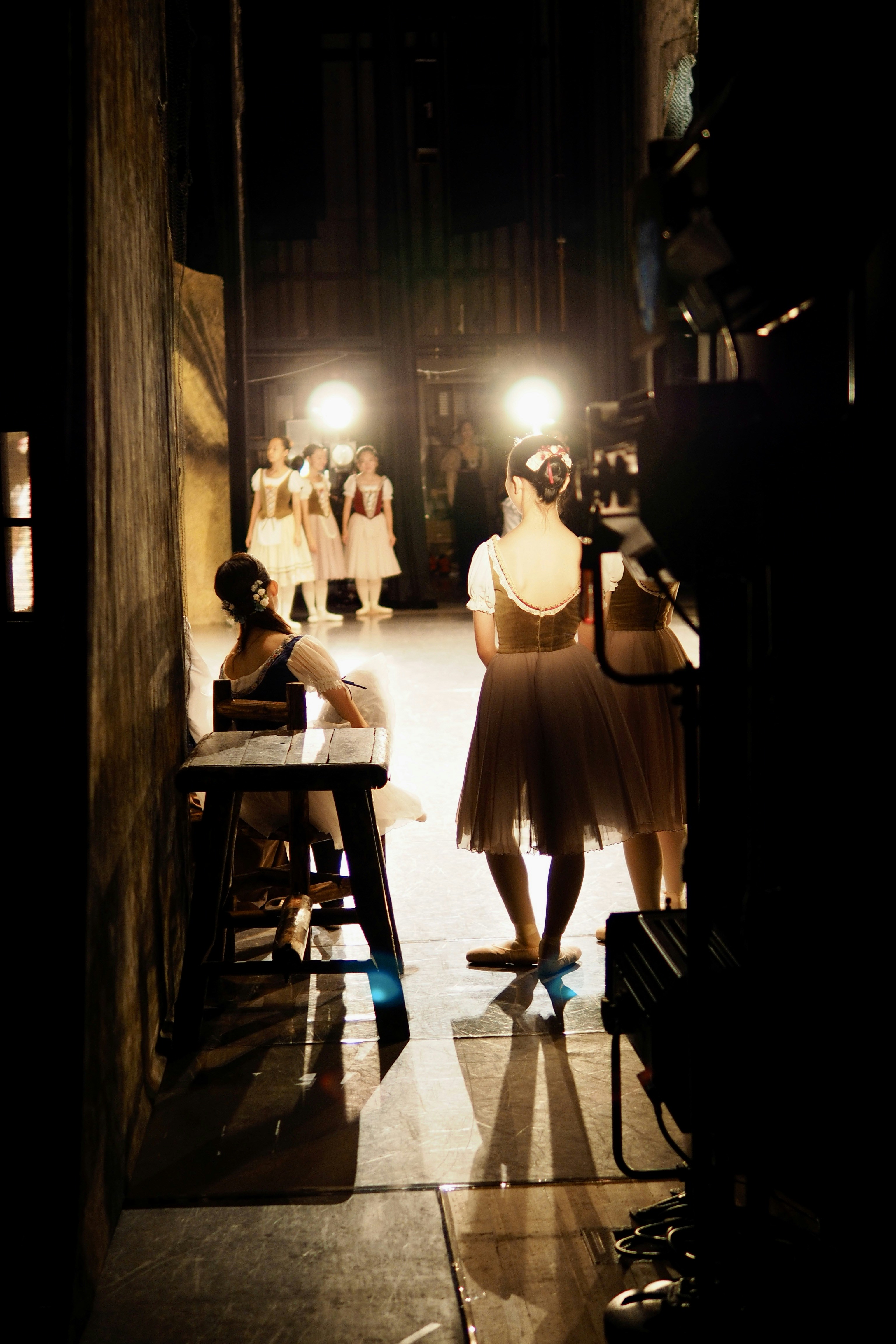 a couple of people that are standing in the dark