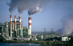 a factory with smoke coming out of it's stacks