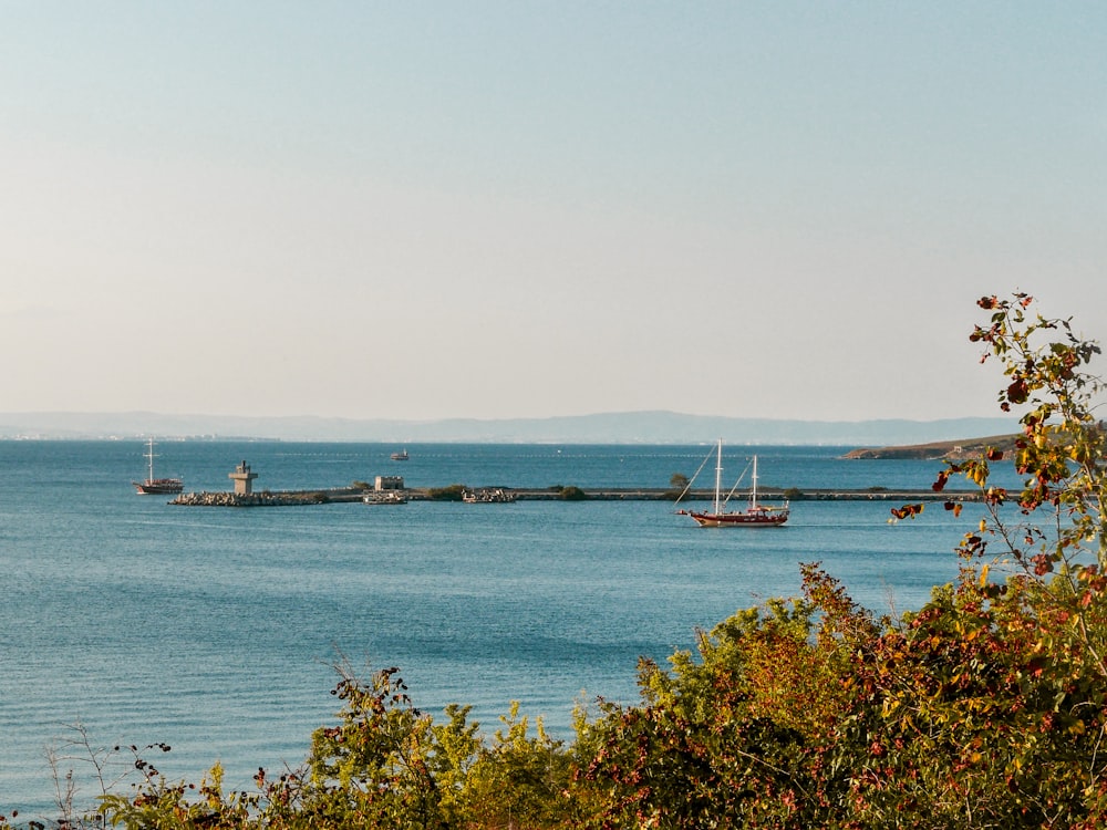 a body of water with boats in the distance