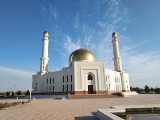 a large white building with a gold dome