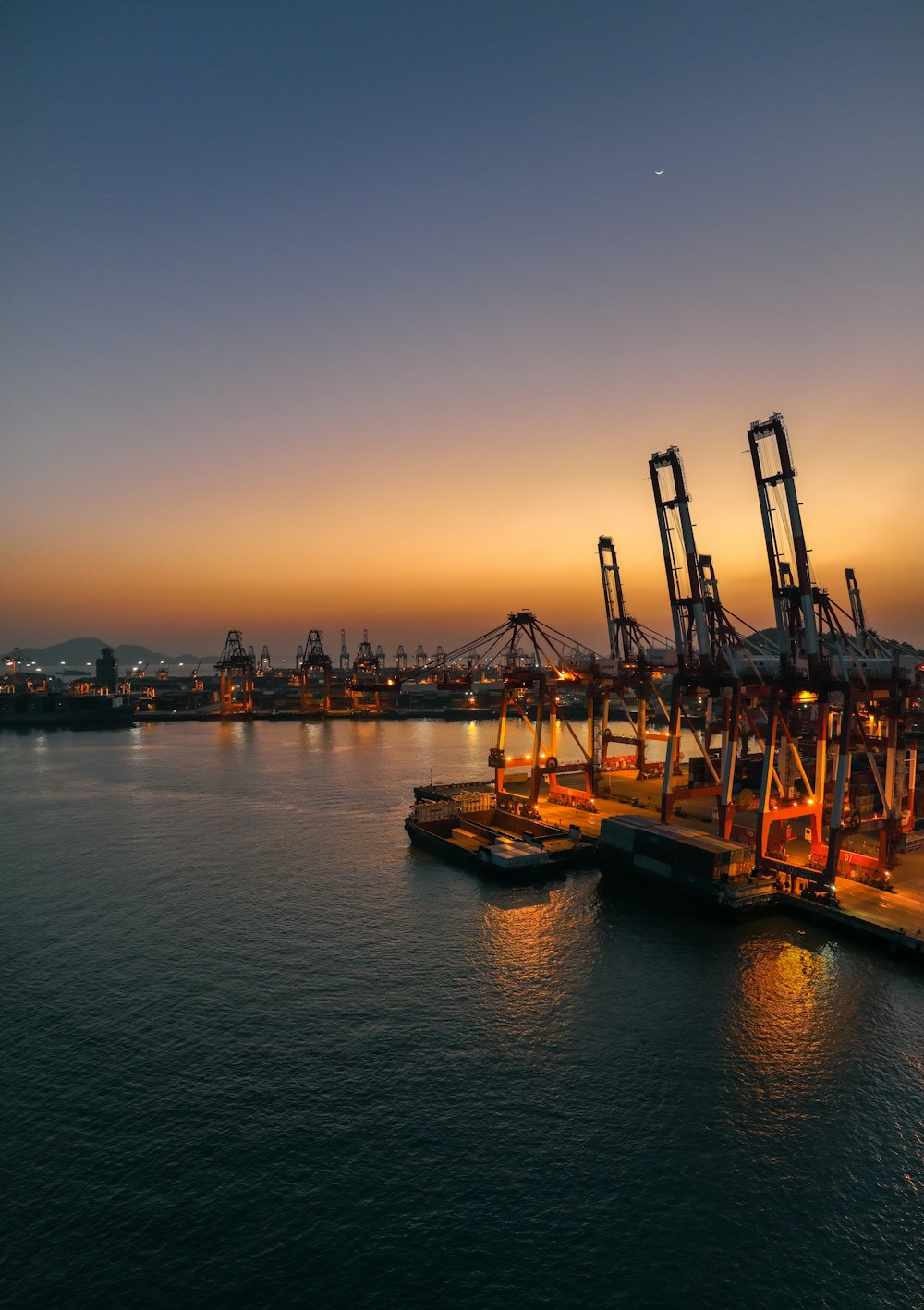 a harbor filled with lots of large cranes