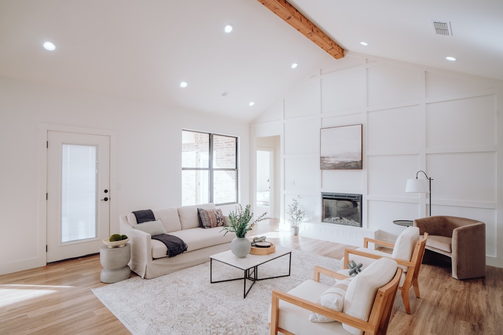 a living room filled with furniture and a fire place