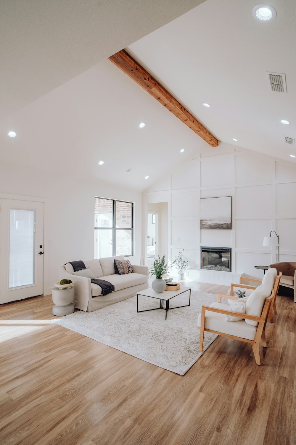 a living room with a couch a chair and a fireplace