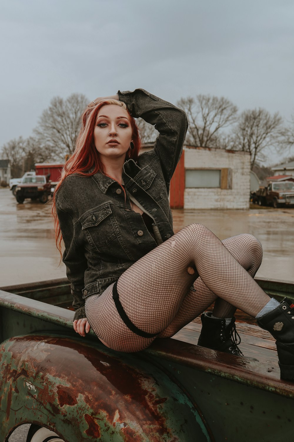 a woman sitting in the back of a truck