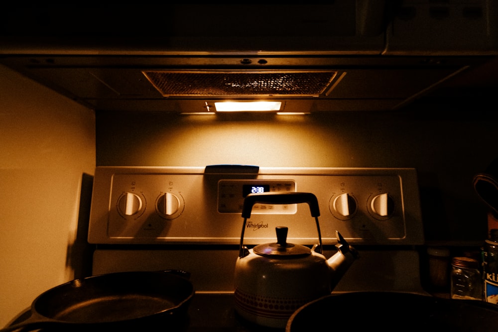 a tea kettle sitting on top of a stove