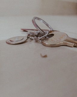 A close-up of keys handed over to a new commercial property owner
