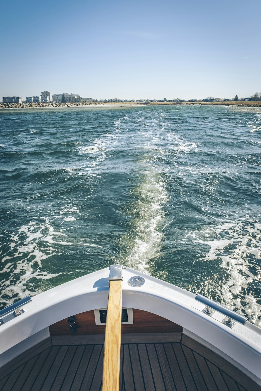 a view of the back of a boat in the water