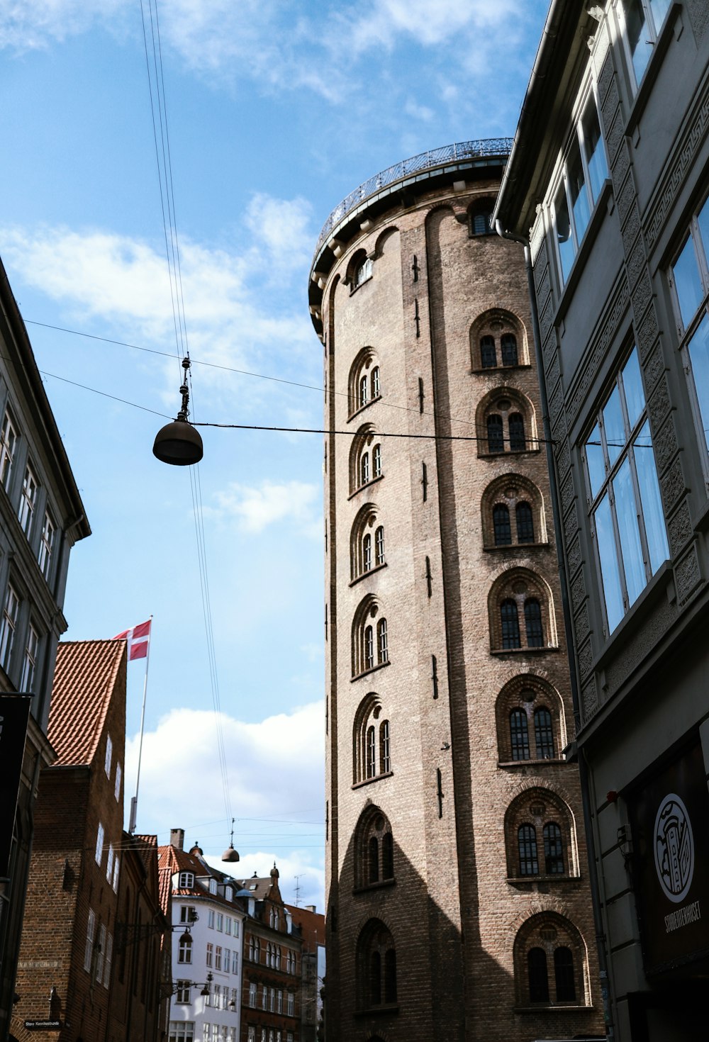 a tall tower with a clock on the side of it