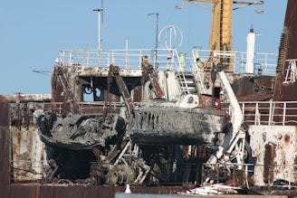 a large ship sitting on top of a dry dock