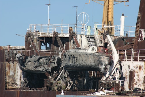a large ship sitting on top of a dry dock