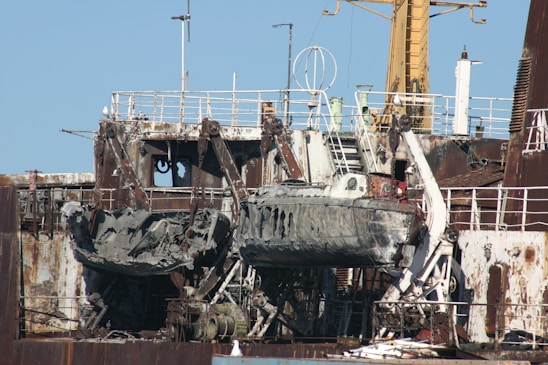 a large ship sitting on top of a dry dock