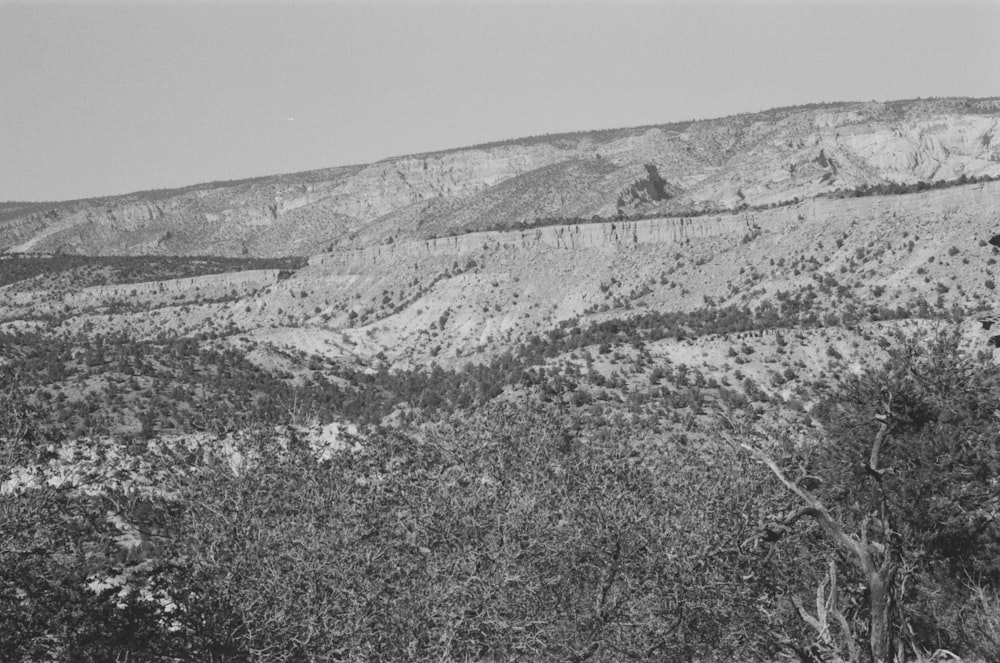 a black and white photo of a mountain range