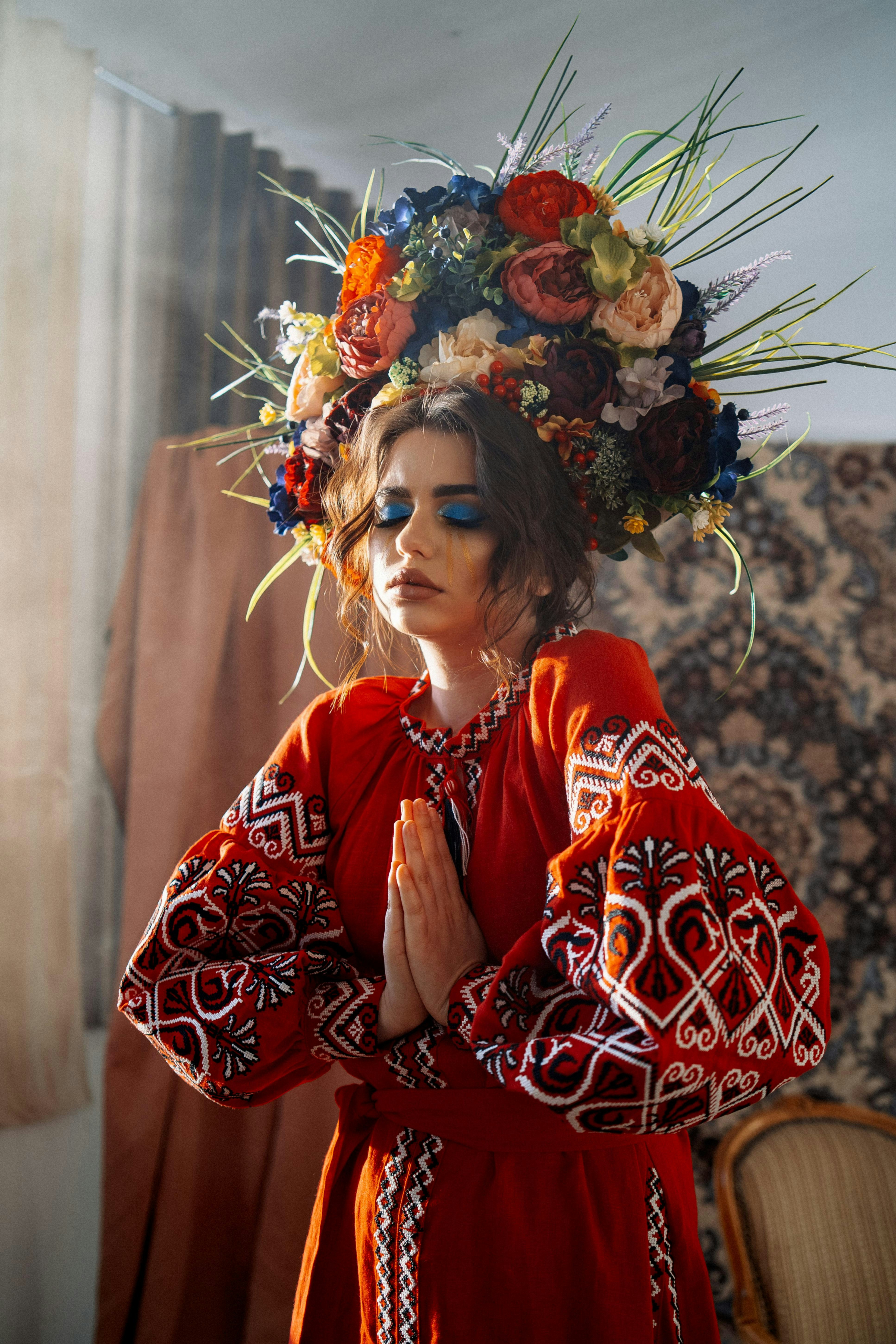 A woman in a red dress with a flower crown on her head photo – Free ...