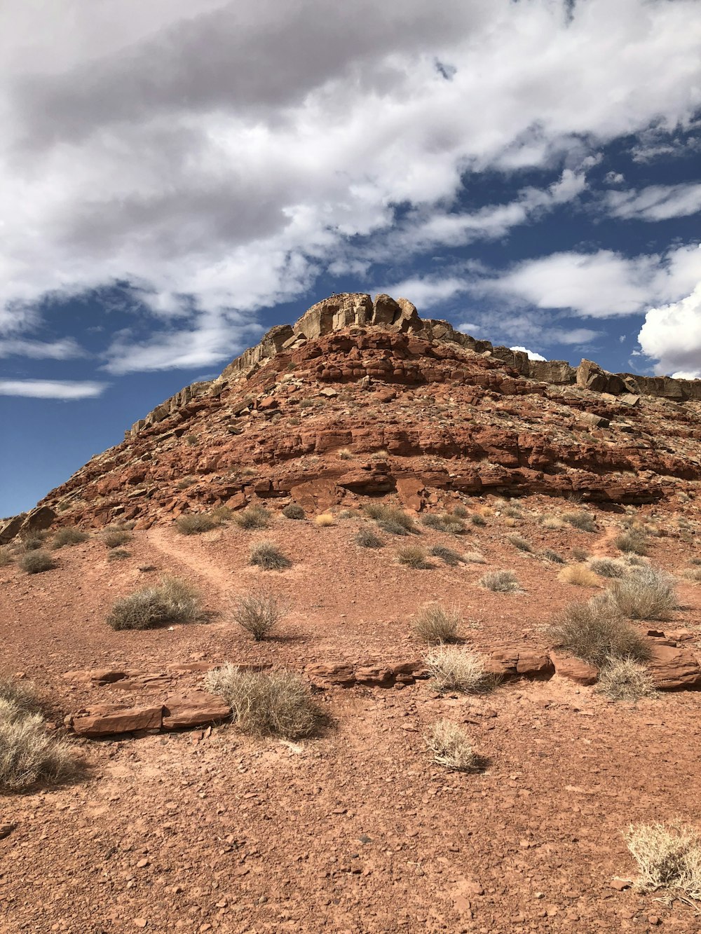 a large rock formation in the middle of a desert