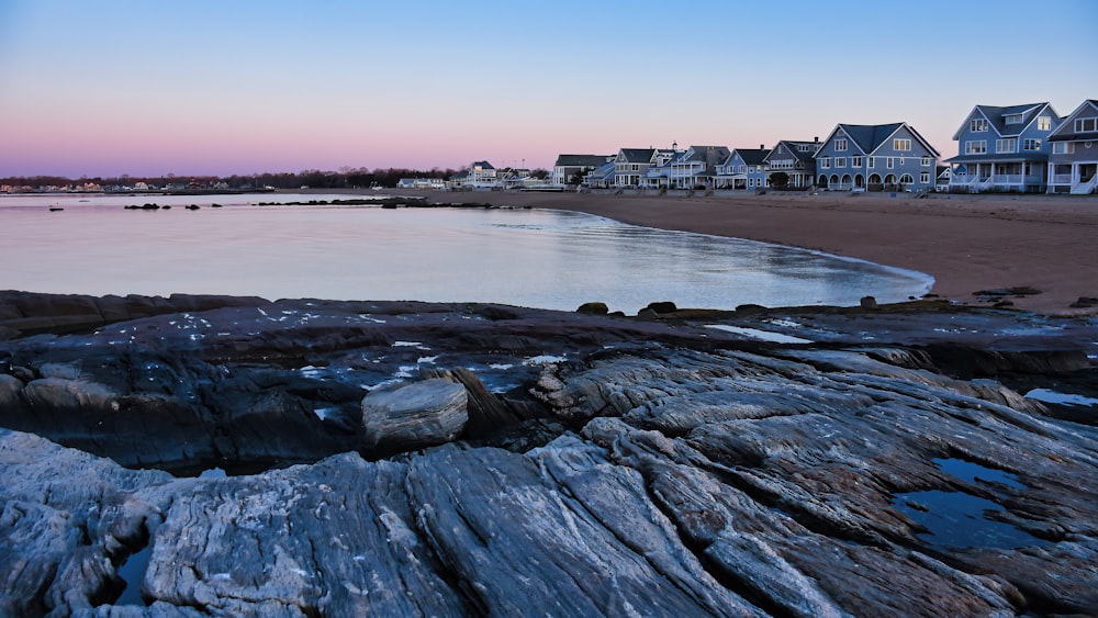 a large body of water sitting next to a sandy beach