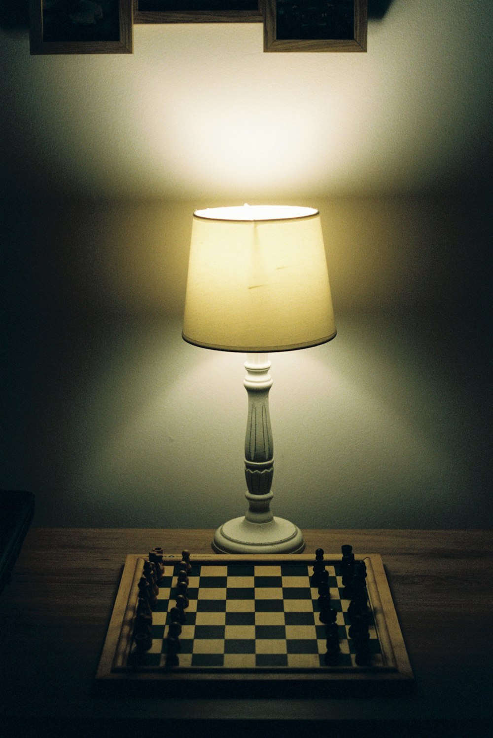 a lamp is lit on a chess board