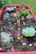 A tiny garden scene with miniature flowers and furniture from Petite People Plus.