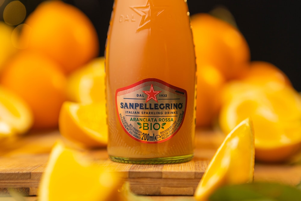 a bottle of san pellegrino on a cutting board