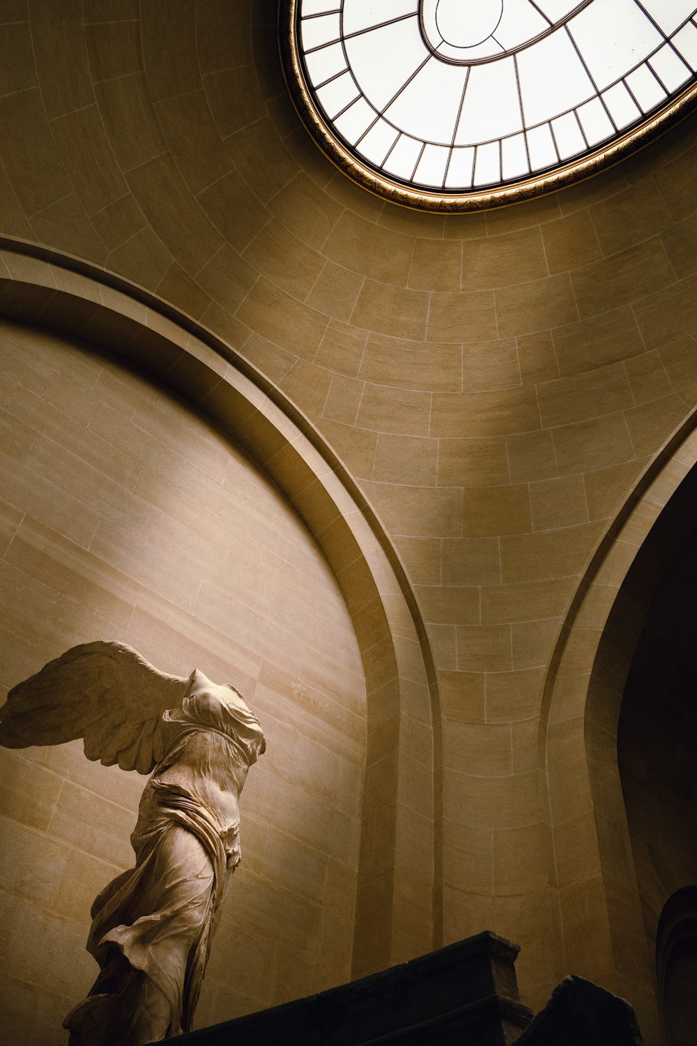 a statue of an angel in a church