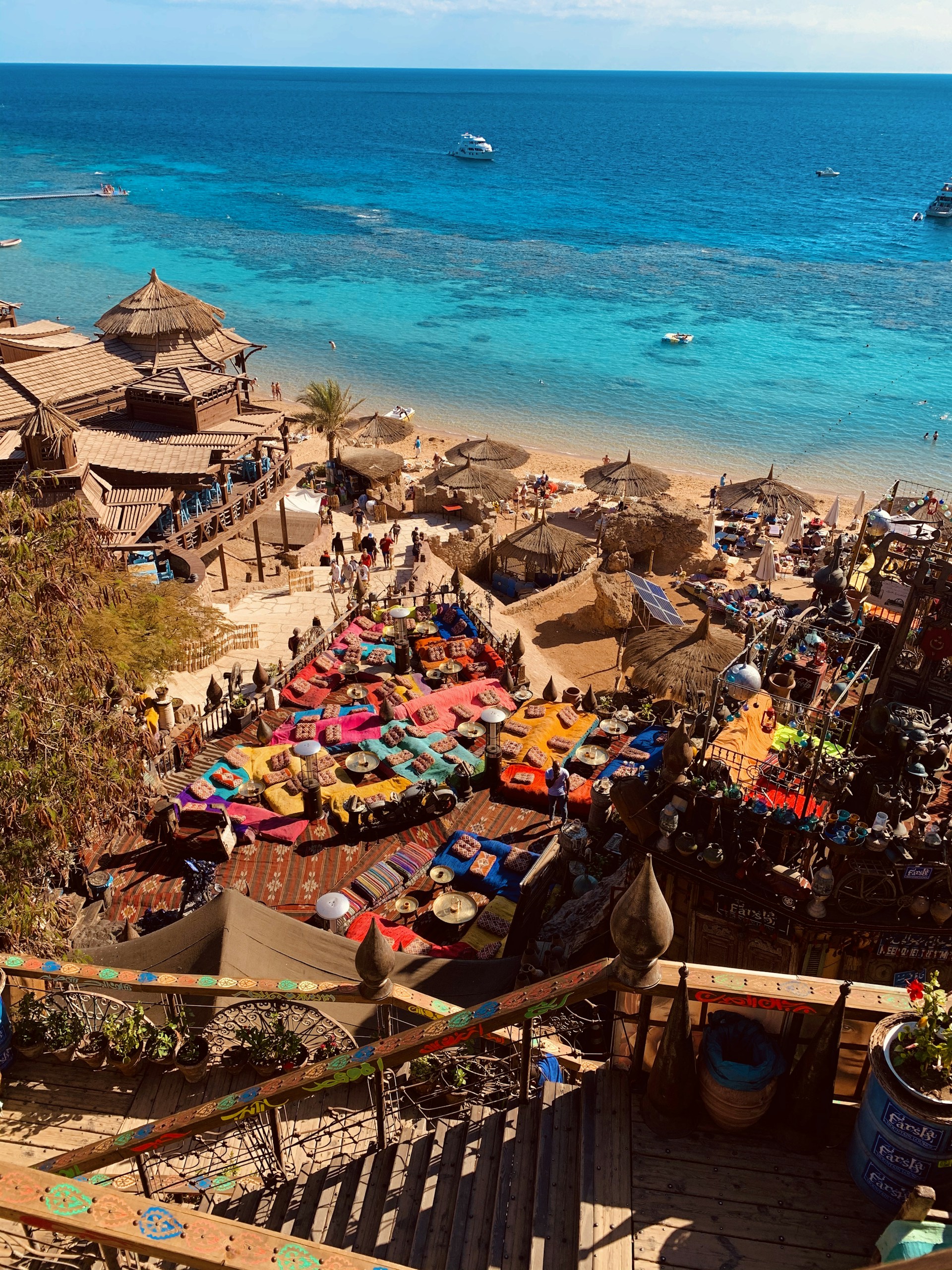 a bunch of umbrellas that are on a beach