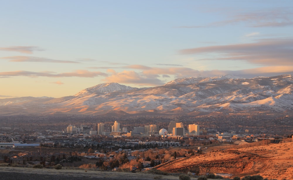 a view of a city with mountains in the background