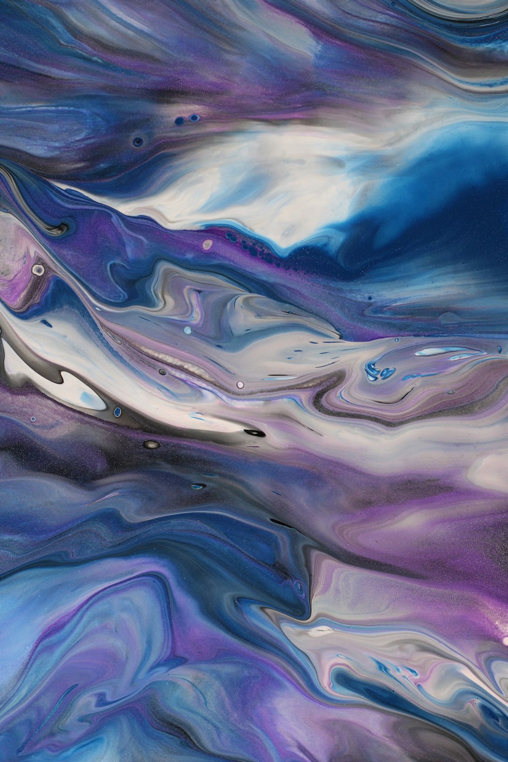 an abstract painting with blue, purple, and white colors