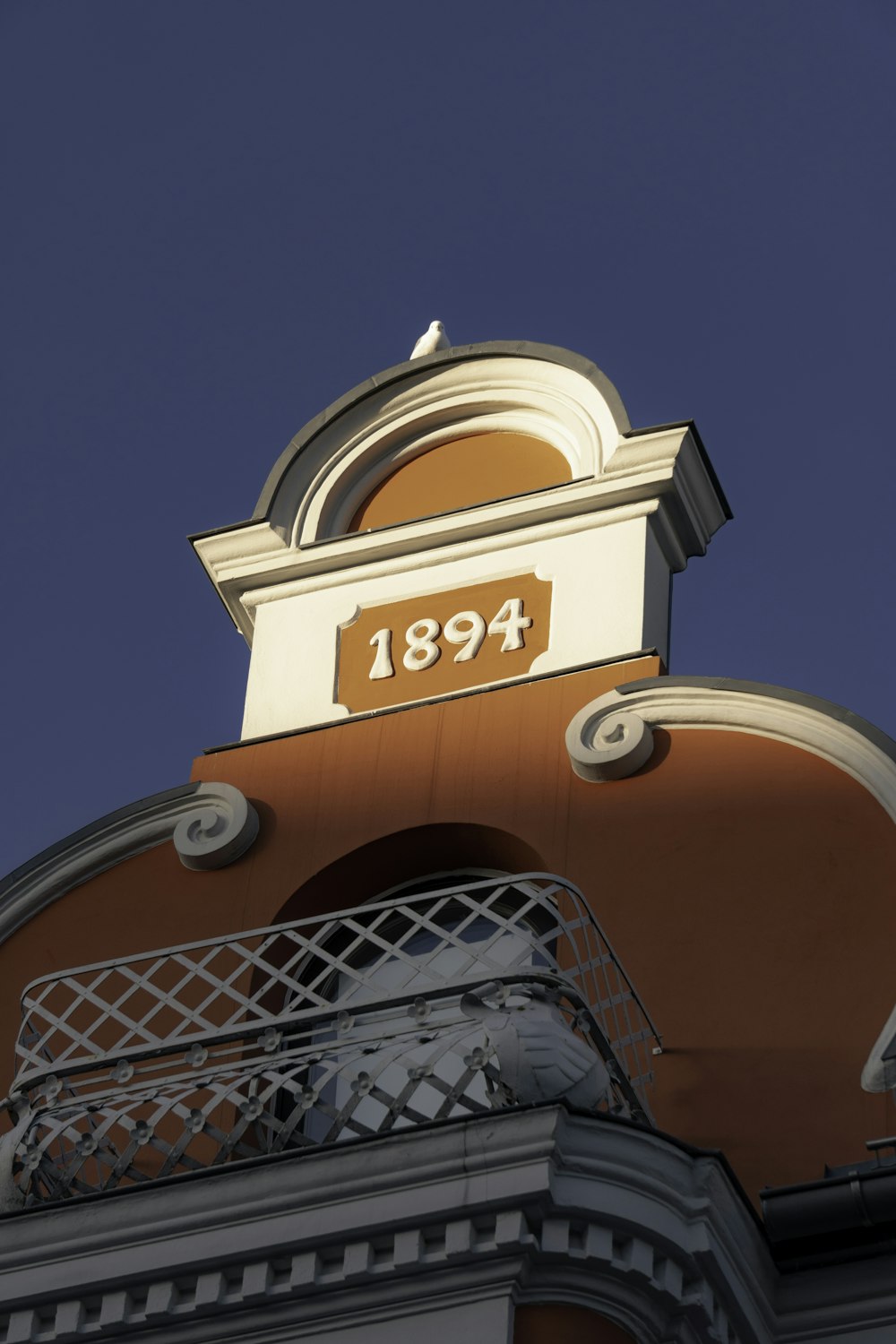 a clock on top of a building with a sky background