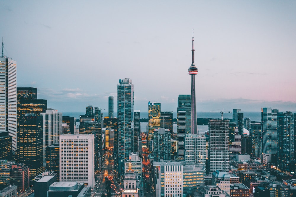 a view of a city at dusk from the top of a skyscraper