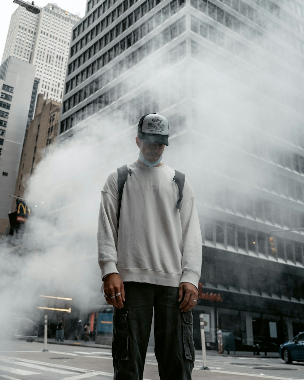 a man standing in the middle of a street