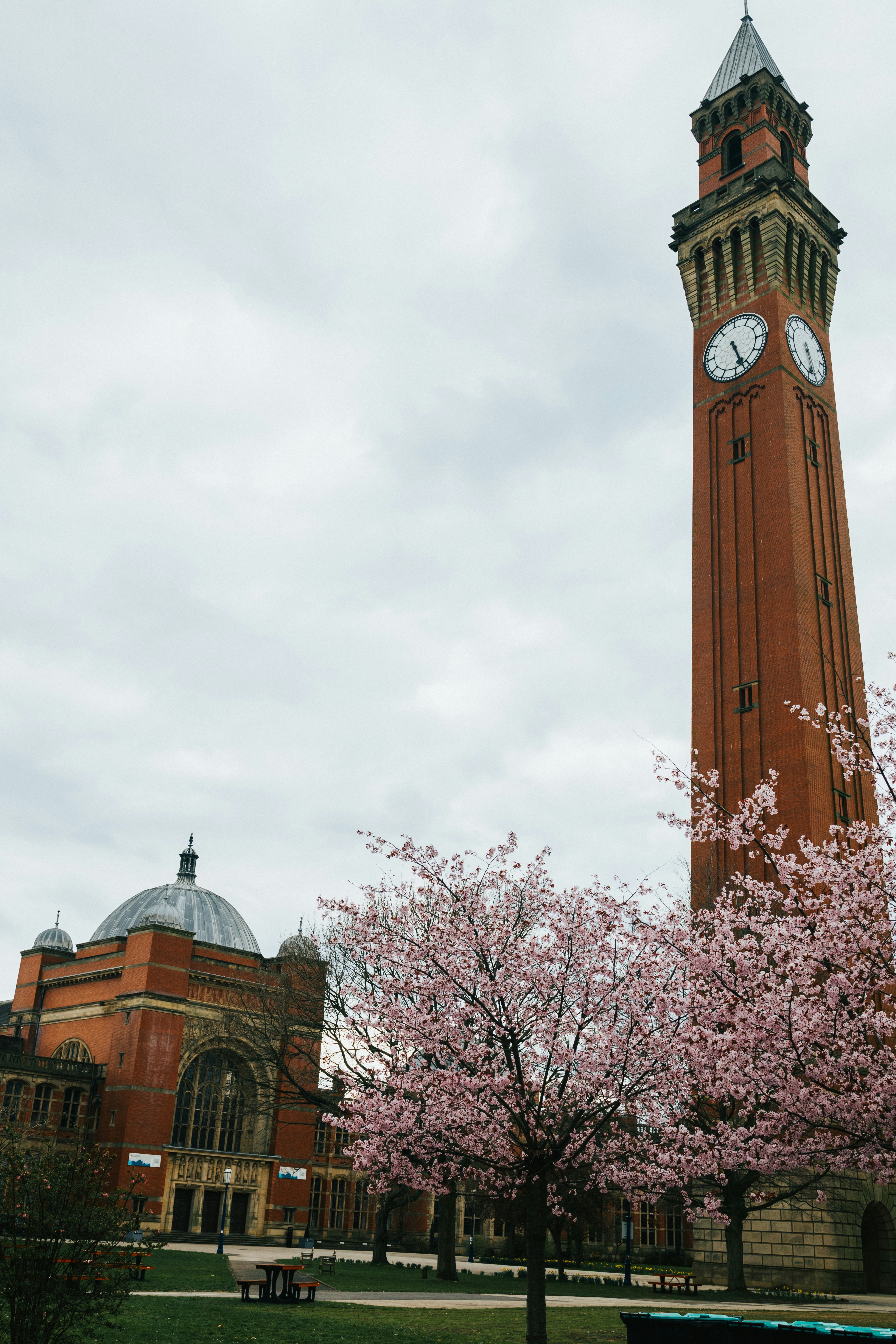 a tall clock tower with a clock on each of it's sides