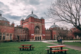 a couple of benches sitting in front of a building