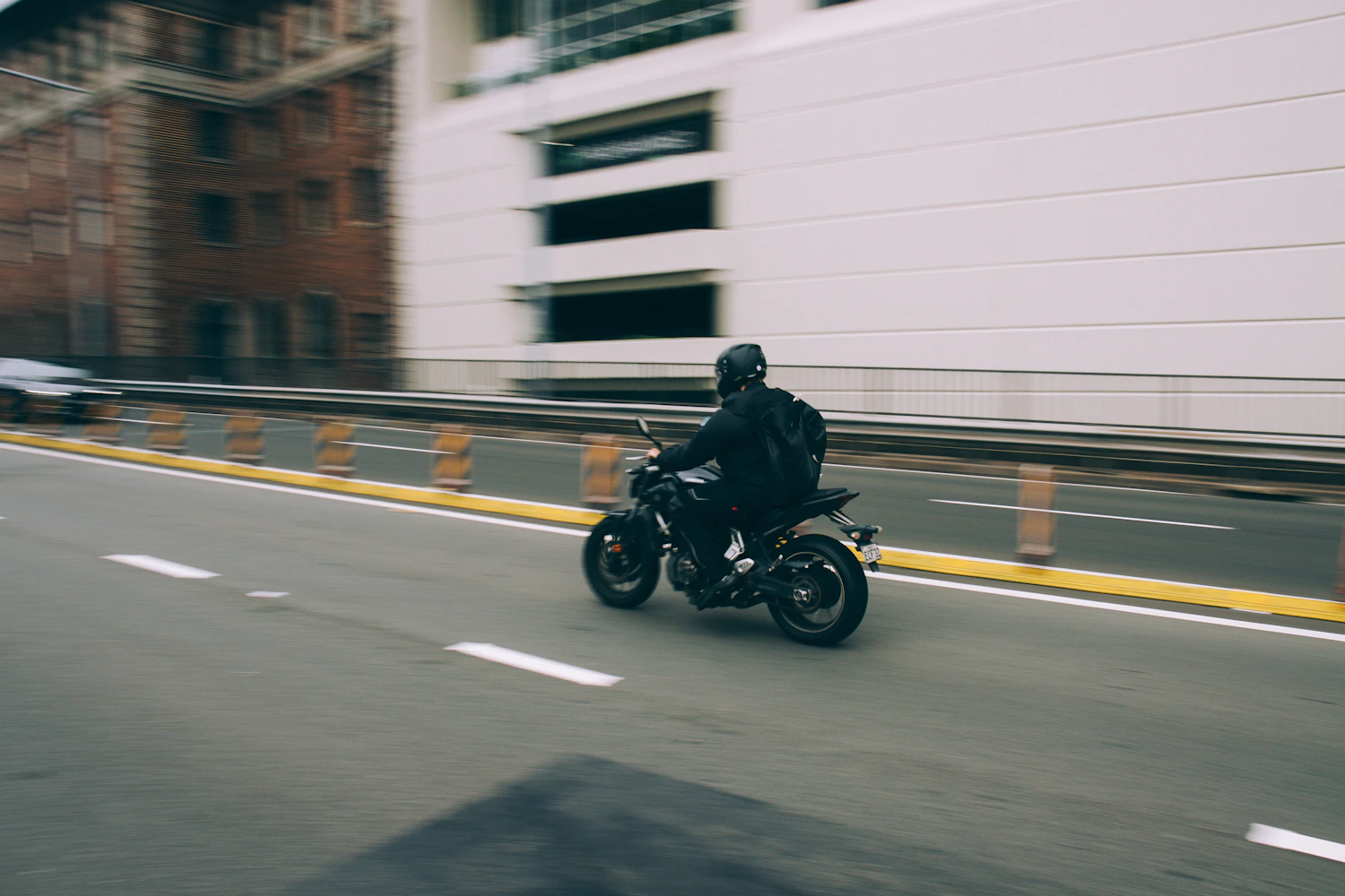 Rider on a naked motorcycle in city traffic