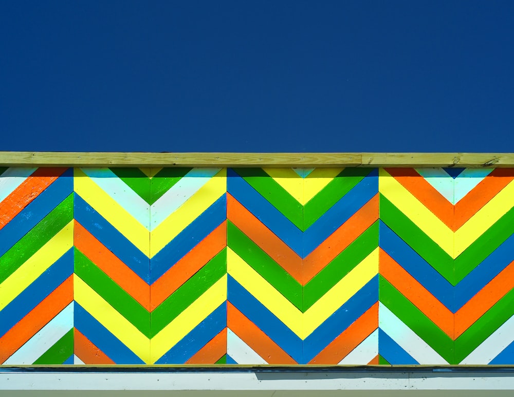 a colorful chevron pattern painted on the side of a building
