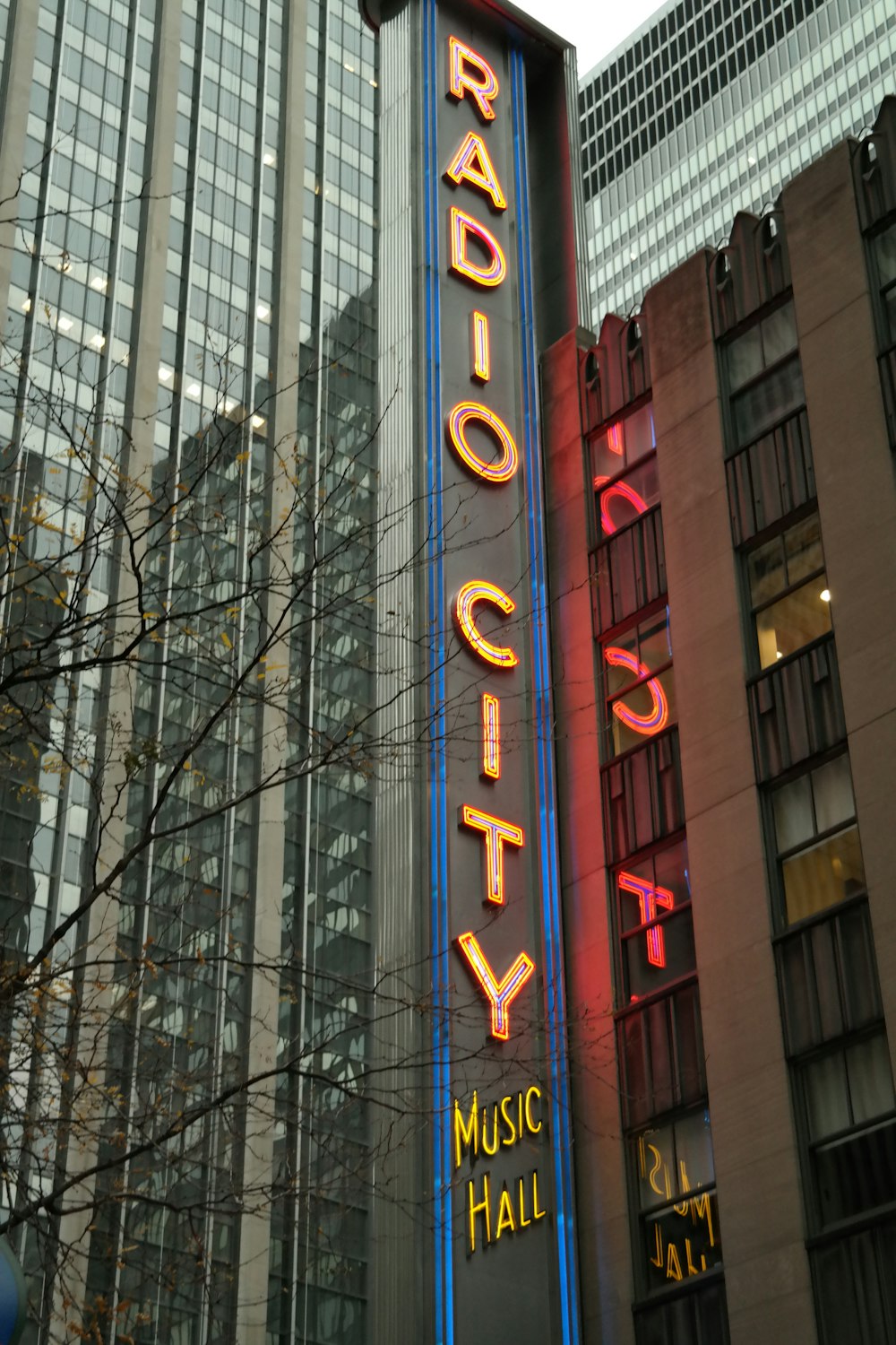 the radio city music hall sign is lit up