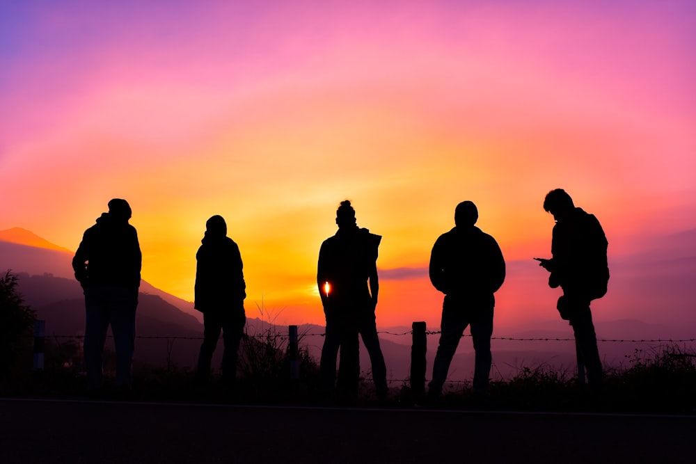 a group of people standing next to each other