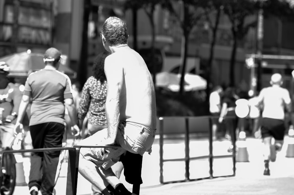 a man riding a skateboard down a sidewalk