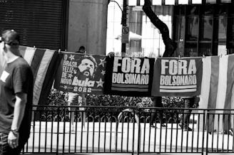 A vibrant political rally in Santa Catarina with supporters waving flags and banners.