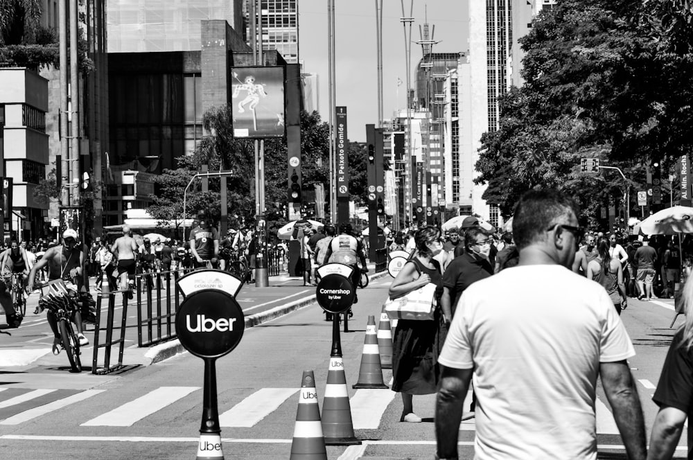 a black and white photo of a busy city street