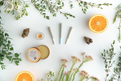 a white table topped with oranges and other items