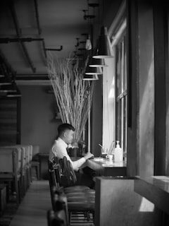 A serene coffee shop scene with a writer deep in thought.
