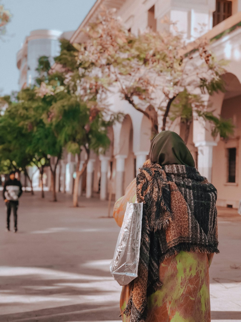 a woman walking down a street