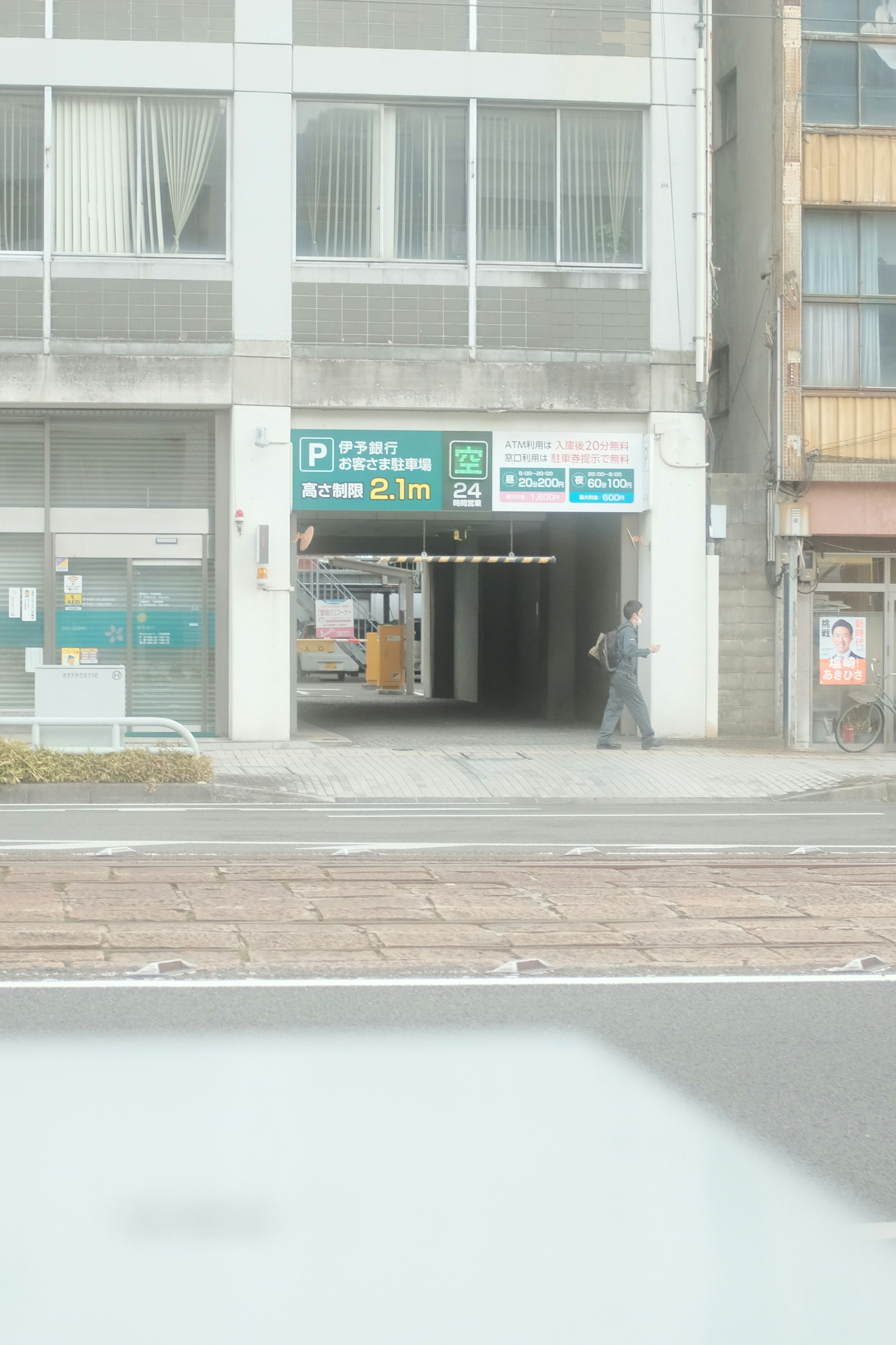 a man is walking out of a tunnel on the street