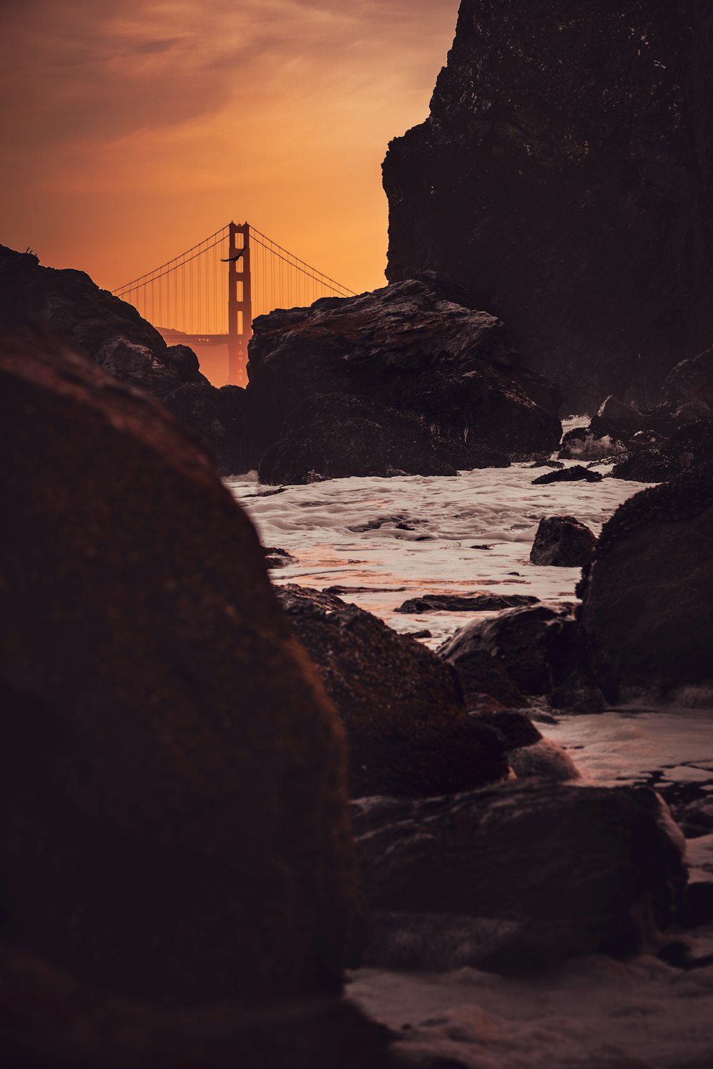 a view of the golden gate bridge at sunset