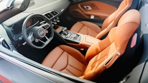 the interior of a car with leather seats